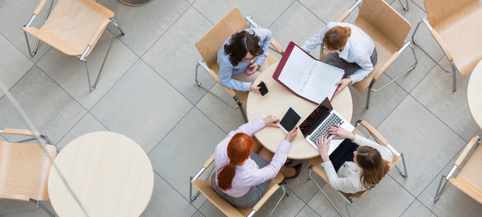 High angle view of businesswomen working in office canteen